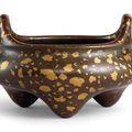 An inscribed gold-splashed bronze tripod incense burner, Qing dynasty, 18th century