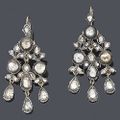 A pair of diamond pendent earrings of girandole design