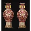 A fine pair of 'famille-rose' wall vases. Qianlong seal marks and period