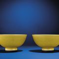A fine pair of yellow-enamelled incised 'Dragon' bowls, Guangxu six-character marks and of the period (1875-1908) 