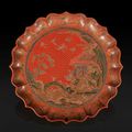 A rare polychrome lacquer barbed-rim dish - Qianlong six-character mark and of the period