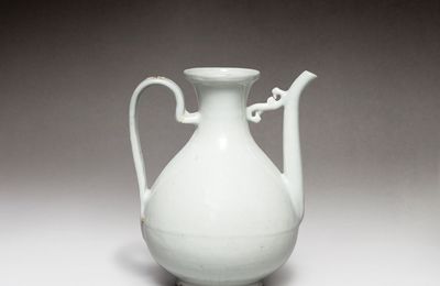 A white-glazed incised 'dragon' ewer, Ming dynasty, 16th century
