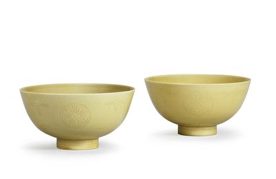 A pair of yellow-glazed incised bowls, Kangxi six-character marks and of the period (1662-1722)