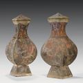 A pair of painted grey pottery faceted jars and cover, fanghu, Han dynasty (206 BC-AD 220) 