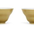 A pair of café-au-lait-glazed ogee-shaped bowls, Qianlong seal marks and of the period