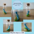 Baby blue dragon in a bottle