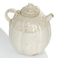 A fine small cream-glazed moulded wine ewer and cover, China, Song dynasty