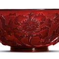 A carved transparent red glass bowl, Qianlong incised four-character mark within a square and of the period (1736-1795)