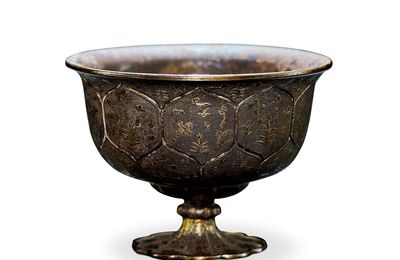 A gilt-silver 'birds and flowers' stem cup, Tang dynasty (618-907)