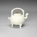 A creamy white crackle glazed, soft paste ewer and cover, He, 18th century