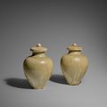 Two green glazed stoneware jars and covers, Sui dynasty (589-618)