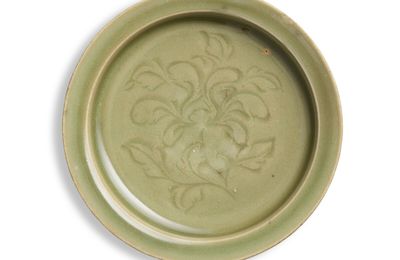 A carved Yaozhou celadon 'floral' dish, Northern Song dynasty