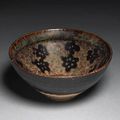 A Jizhou pottery tea bowl with reserve flower head decoration. Song Dynasty