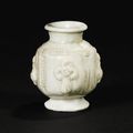 A small white-glazed 'Buddha' lantern vase, Five Dynasties, 10th century