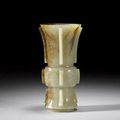 An archaistic white and russet jade vase, gu - 19th century