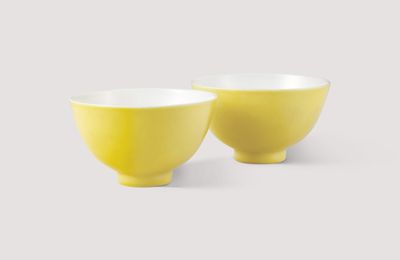 A pair of lemon-enamelled tea bowls, Yongzheng six-character marks in underglaze blue within a double circle and of the period (1723-1735)