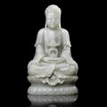 A rare pale green jade carving of Buddha and a stand, 18th-19th century