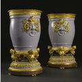 A fine pair of French Louis XVI style gilt-bronze mounted Sèvres lilac-grey porcelain vases "Tabouret" and liners