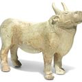 A straw-glazed pottery model of an ox, Tang Dynasty (618-907)