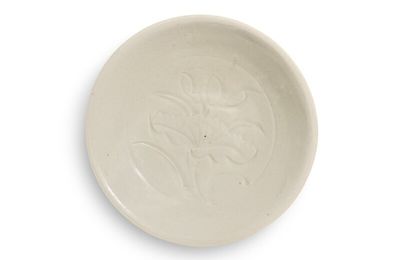 A carved 'Ding' 'lotus' dish, Northern Song dynasty
