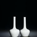 A fine and very rare pair of incised white-glazed bottle vases, Yongzheng marks and of the period (1723-1735)
