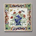 A wucai 'Flower and butterfly' dish, Jiajing mark and period (1522-1566)