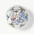 A fine wucai 'Dragon and Phoenix' saucer, mark and period of Wanli (1573-1620)