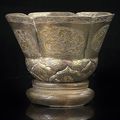 A good part-gilt blossom-shaped silver cup, China, Tang or Song dynasty 