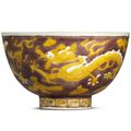 A rare aubergine-ground and yellow-enamelled ‘dragon’ bowl, Wanli six-character mark and of the period (1573-1619)