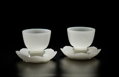 An exquisite pair of white jade cups and stands, Qianlong period (1736-1795)