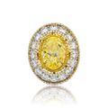A 5.01 carat fancy yellow diamond and diamond ring