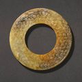A brown and russet jade disc, huan, Western Han dynasty (206 BC-AD 24)