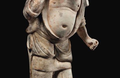 A rare painted grey pottery figure of a foreign groom, Tang dynasty (AD 618-907)