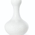 A white-glazed molded soft-paste porcelain 'garlic head' bottle vase, 18th century 