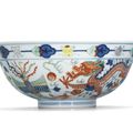 A wucai 'dragon and phoenix' bowl, Guangxu six-character mark in underglaze blue and of the period (1875-1908)