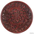 A very rare red lacquer saucer-dish of shallow form, China, early Ming dynasty (1368-1644), probably late 14th century.