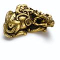 A gilt-bronze 'deer' paperweight, Ming dynasty