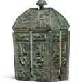 A rare finely cast bronze ritual wine vessel and cover, fangyi, Shang dynasty, 13th-11th century BC