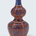 An unusual iron-red and blue and white hexagonal double-gourd vase, Wanli period (1573-1619)