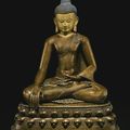 A large and rare bronze figure of Buddha Shakyamuni inlaid with silver and copper, Tibet, 13th Century