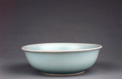 A rare pale celadon-glazed shallow bowl, dated by inscription to Wanli cyclical xinmao year, corresponding to 1591 and of the pe