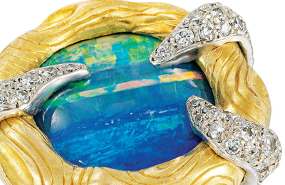 An oval opal and diamond ring, by Andrew Grima