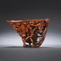 A finely carved 'grapes and squirrels' rhinoceros horn libation cup. Early Qing dynasty