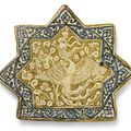 A Kashan lustre pottery star tile with Simurgh, Persia, 14th century