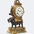 Pendule à l'éléphant en bronze patiné et doré. XVIII° siècle