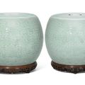 A pair of carved celadon-glazed 'bajixiang' barrel-form stands, Qing dynasty, 18th century