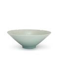 A Qingbai-glazed lobed 'fish and waves' conical bowl, Southern Song dynasty (1127-1279)