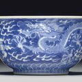 A small blue and white 'dragon' bowl, Qianlong seal mark in underglaze blue and of the period (1736-1795)