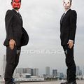 A businessmen wearing masks.