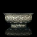 A rare repoussé and parcel-gilt silver bowl, Tang dynasty, early 8th century